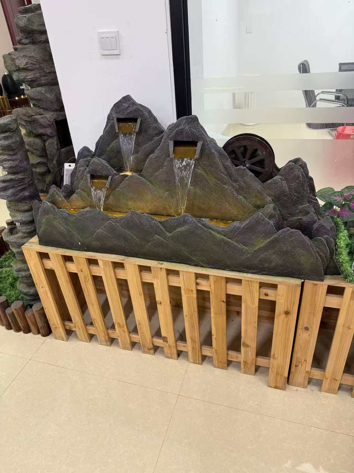 Montagne mountain-shaped fountain with water wheel