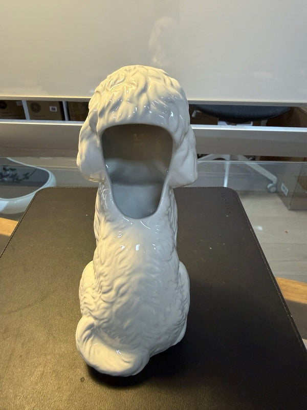 Caniche poodle vase back view showing the flower opening behind the head