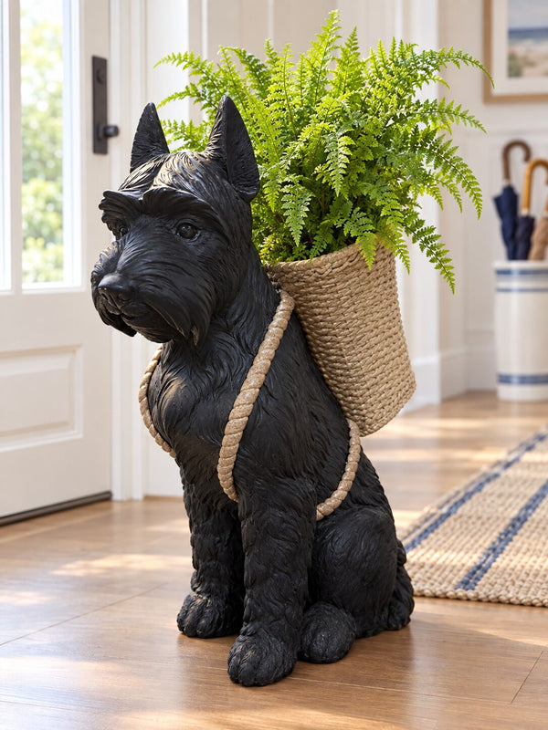Perro black resin sitting dog with fern in basket backpack in an entry hall