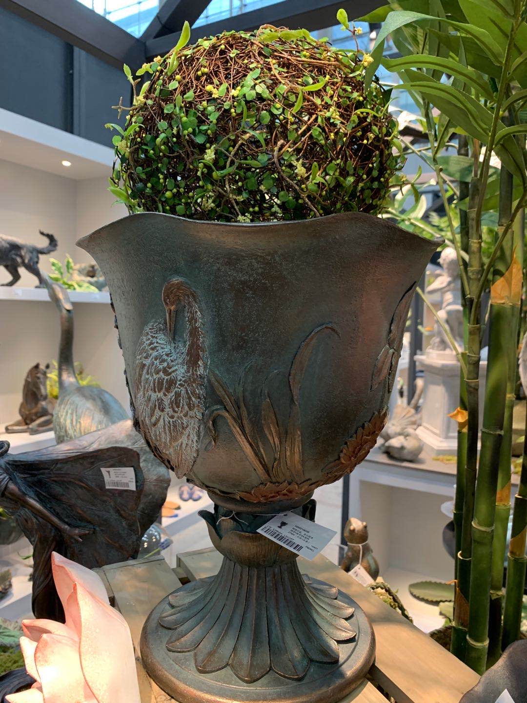 Casa crane bird goblet planter on display in the garden