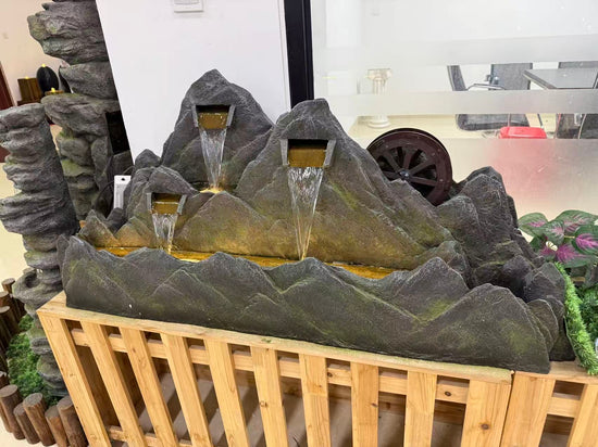 Montagne mountain-shaped fountain with water wheel