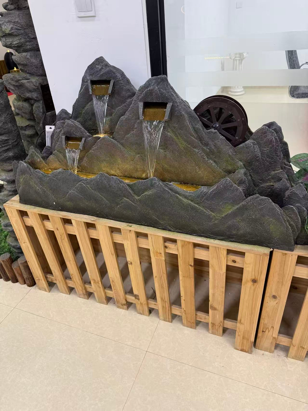 Montagne mountain-shaped fountain with water wheel