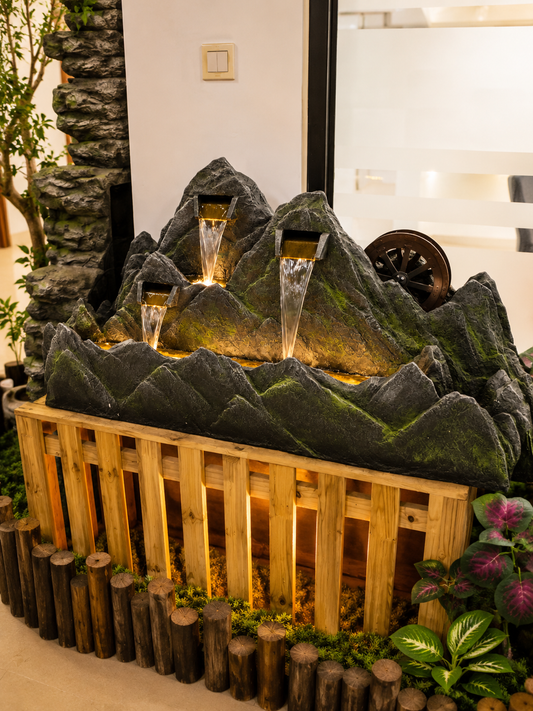 Montagne mountain-shaped fountain with water wheel