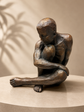 Guapo Sitting Man Copper Colour