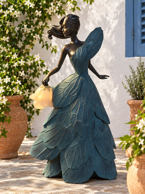 Bianca bronze and blue resin lady statue with tulip lantern in a Mediterranean courtyard