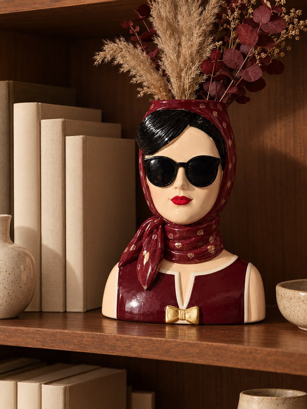 Fashionista burgundy lady vase with pampas and eucalyptus on a bookshelf
