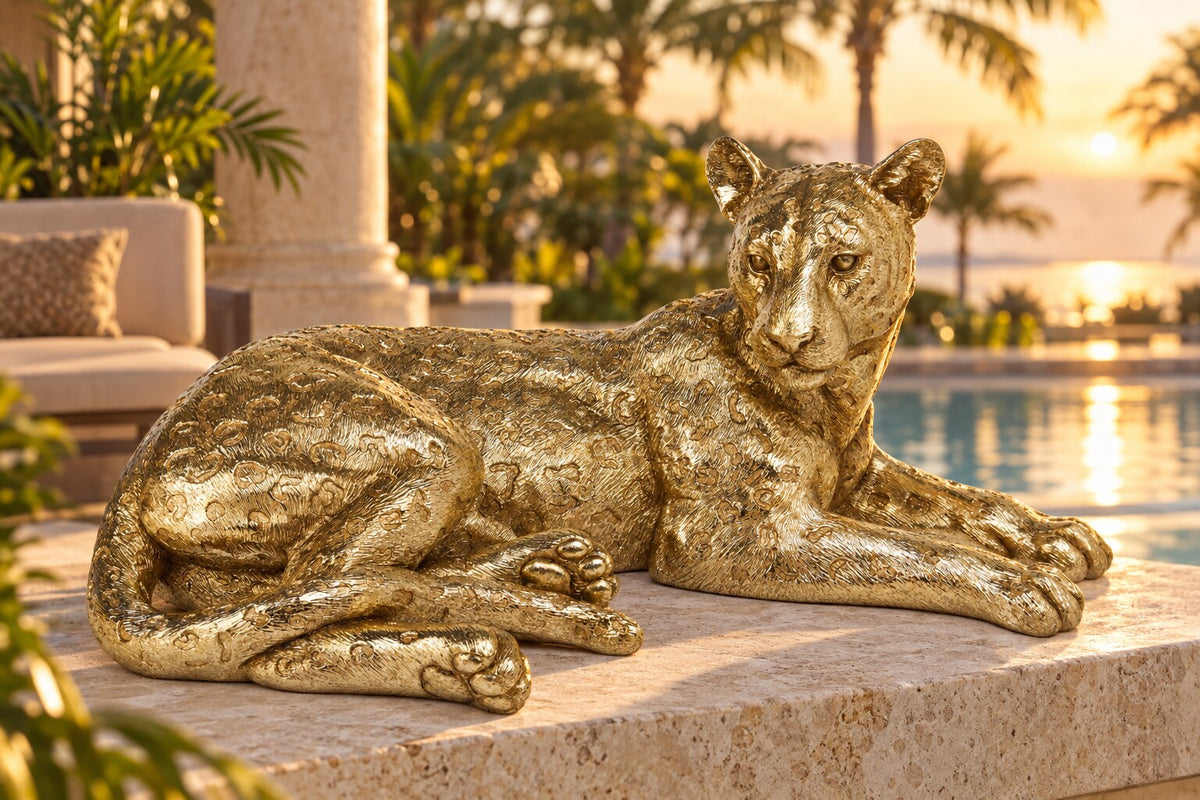 Leopardo gold leopard sculpture on a resort-style terrace at golden hour