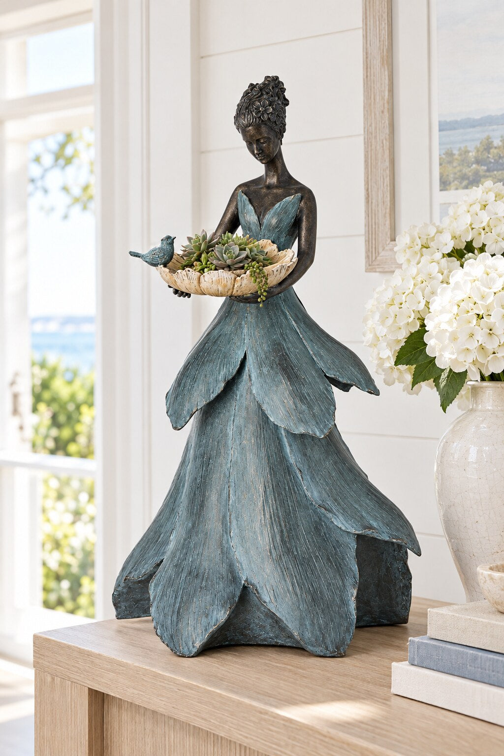 Marisol lady statue with flower dish styled indoors with white hydrangeas