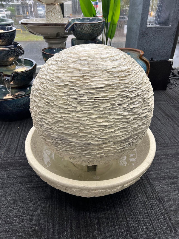 Caliante Outdoor Round Fountain with textured surface and round base Beige or Black Colour
