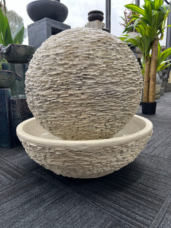 Caliante Outdoor Round Fountain with textured surface and round base Beige or Black Colour