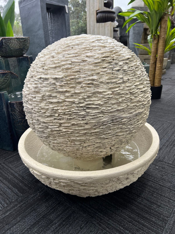 Caliante Outdoor Round Fountain with textured surface and round base Beige or Black Colour